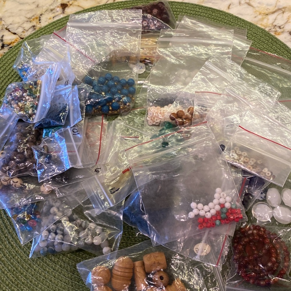 40 bags of assorted beads + 4 extra bags (Glass rock wood, Amber,seed beads)